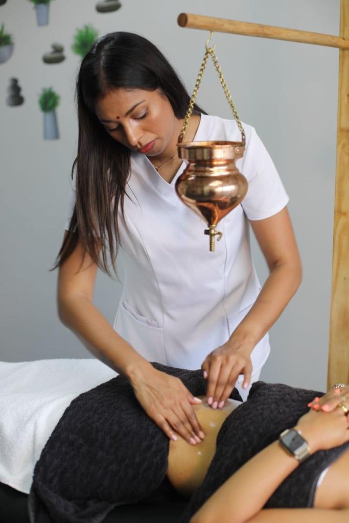 Komona performing Marma point therapy